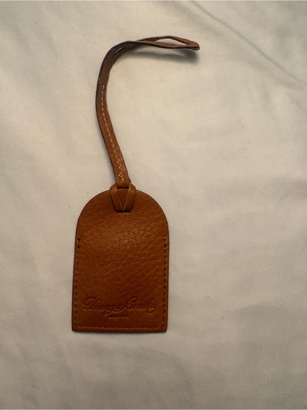 Dooney & Bourke Tan Pebble Leather Luggage bag, purse Tag bag charm